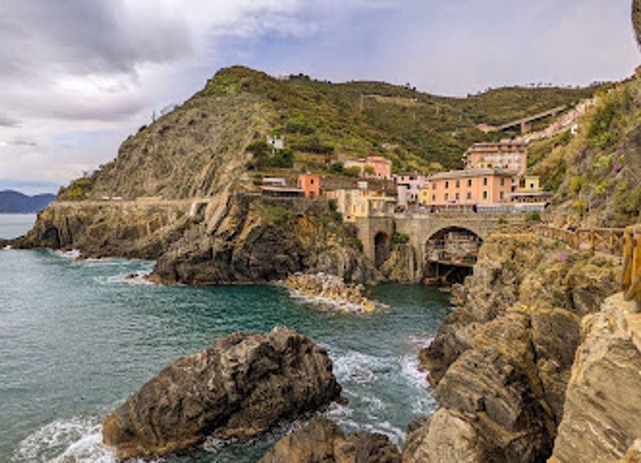 Discover the colorful charm of Riomaggiore, a picturesque village in Cinque Terre, Italy, known for its stunning coastal views and vibrant local culture.