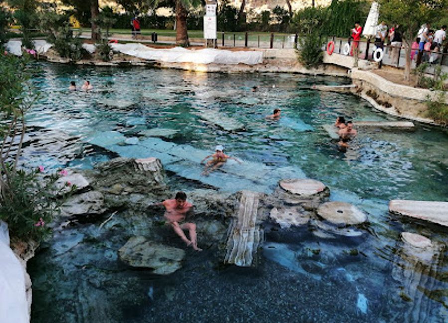 Explore Hierapolis, the enchanting open-air museum of ancient Roman heritage, nestled beside the stunning travertine terraces of Pamukkale.