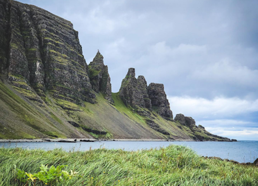 Explore the breathtaking cliffs and serene landscapes of Drangaskörð, a hidden gem in Iceland's Westfjords, perfect for nature lovers and adventurers.