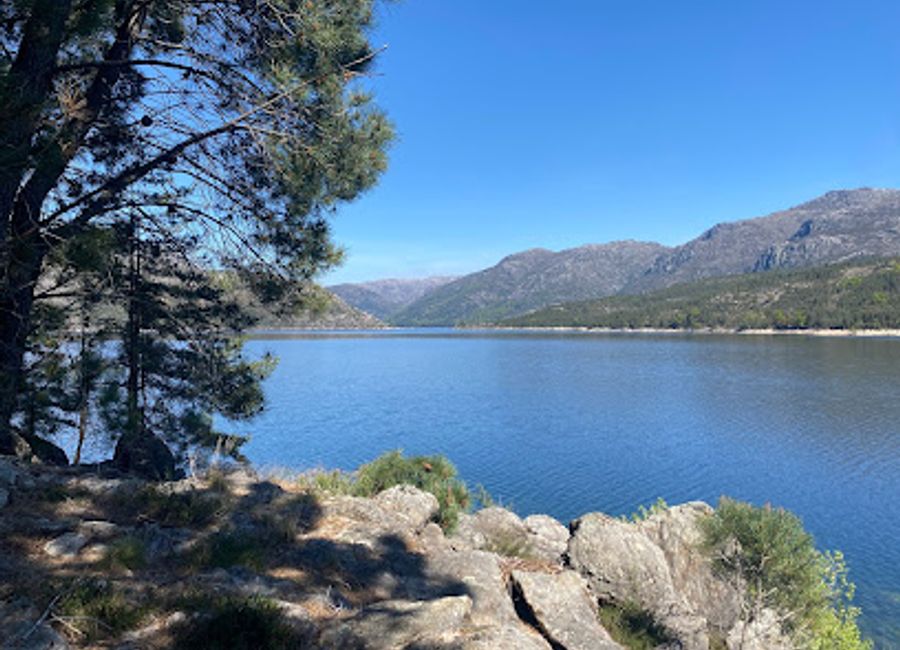 Experience the tranquil beauty of Praia da Quinta da Portelada, a serene beach paradise in Campo do Gerês, Portugal, perfect for relaxation and nature lovers.