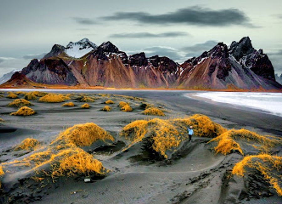Experience the breathtaking landscapes of Stokksnes, where black sand beaches meet majestic mountains in stunning Icelandic scenery.