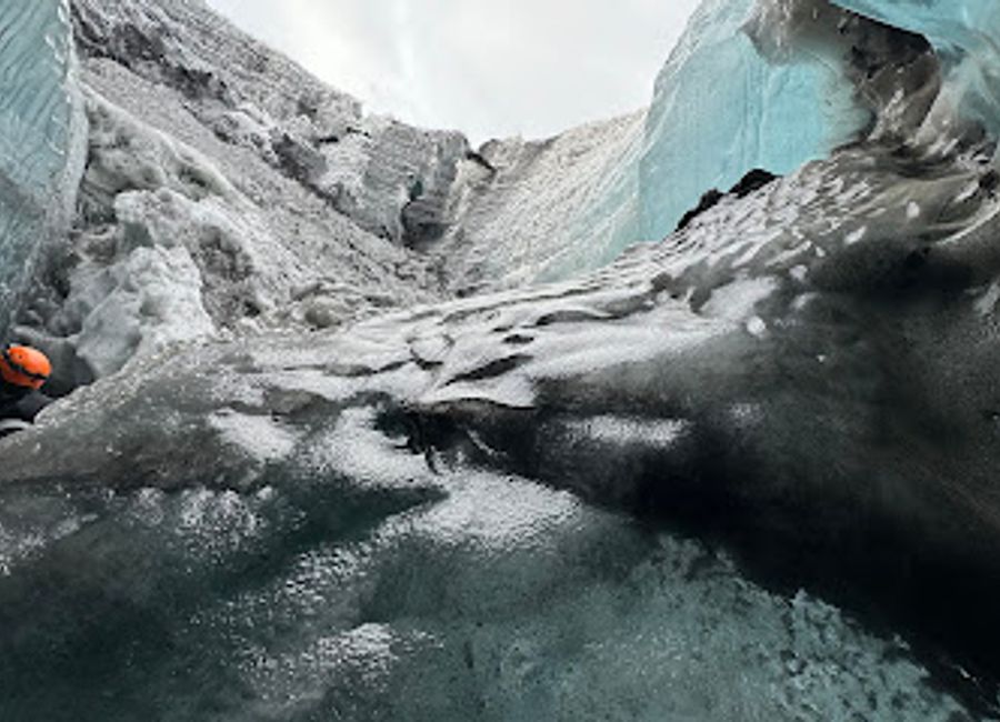 Explore the stunning Blue Ice Cave in Iceland, a breathtaking hiking area filled with mesmerizing blue ice formations and rugged natural beauty.