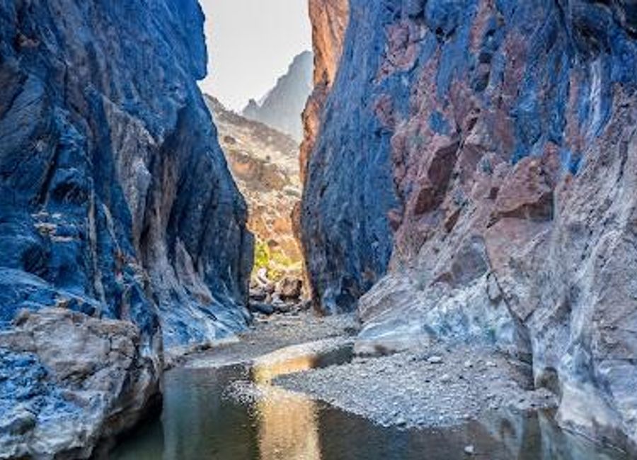 Explore the breathtaking Adventure Snake Canyon in Bima, Oman, a paradise for hikers and nature lovers with stunning landscapes and exhilarating activities.
