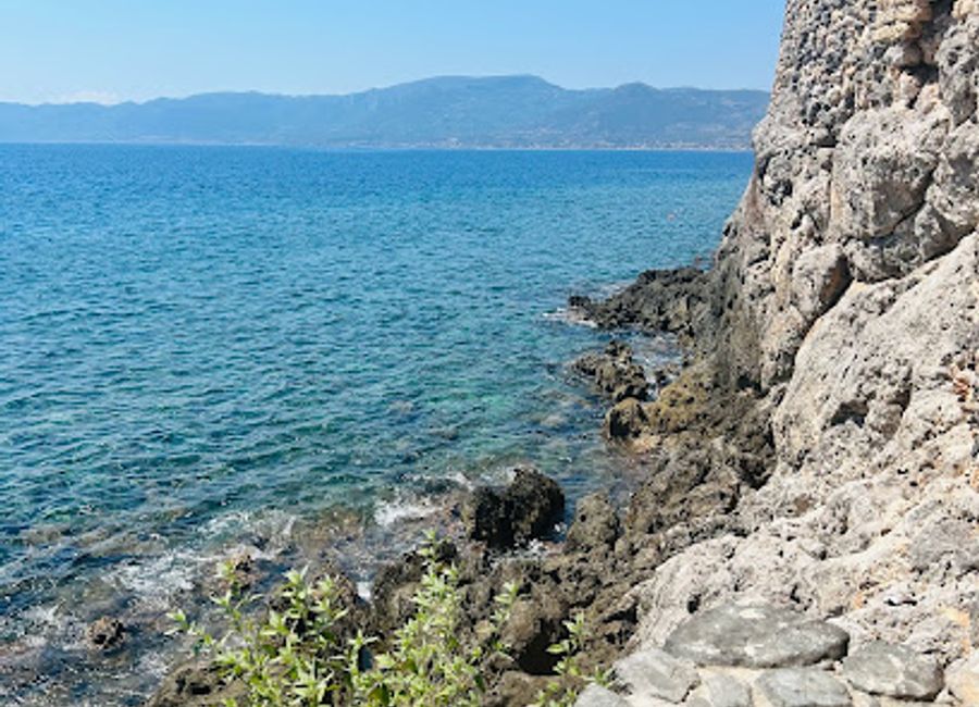 Experience the breathtaking beauty and tranquility of Portello Beach in Monemvasia, Greece - a perfect destination for sun-seekers and nature lovers.