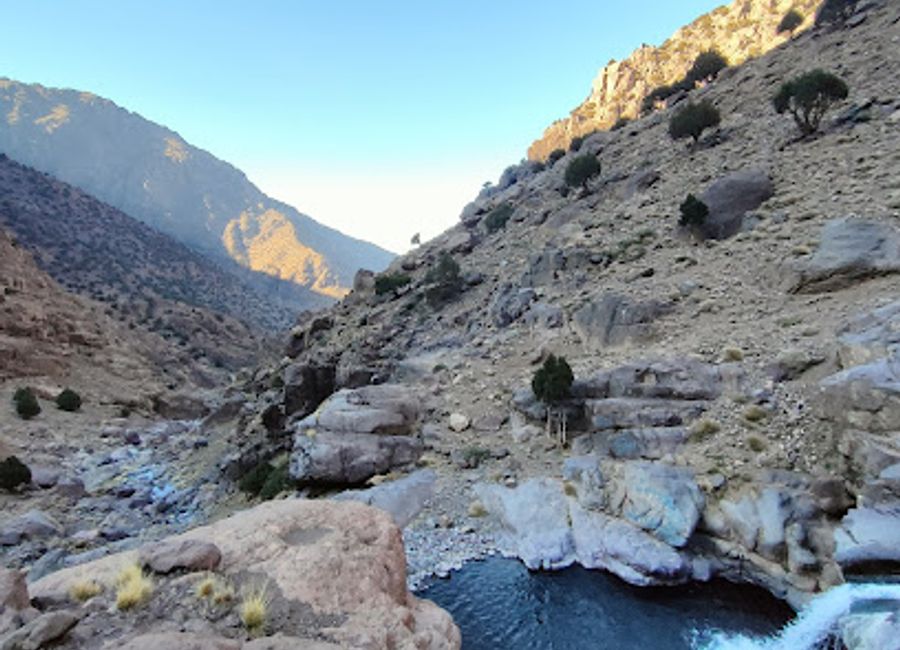 Explore the breathtaking Cascade Sidi Chamharouch, a stunning waterfall in the Atlas Mountains offering adventure, beauty, and tranquility.