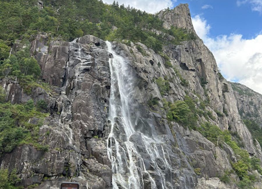 Experience the breathtaking beauty of Revså Fossefall, a stunning waterfall in Forsand, Norway, surrounded by lush nature and dramatic landscapes.
