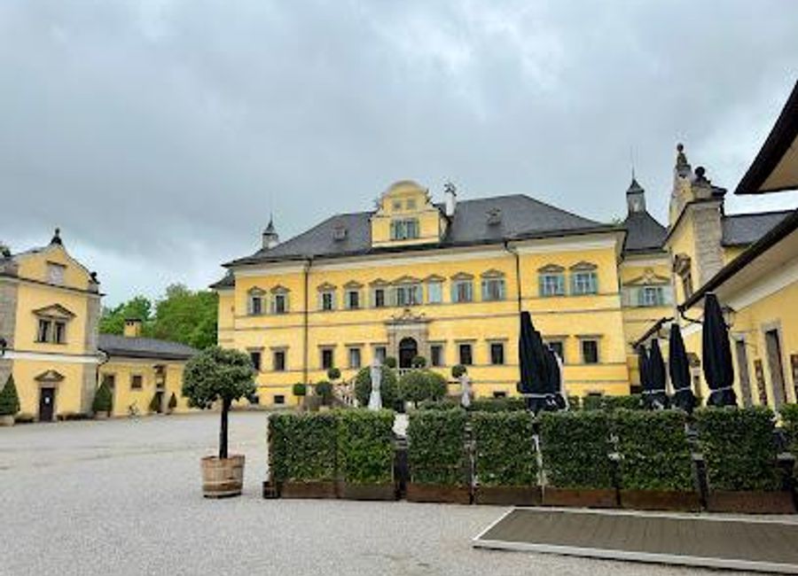 Explore the whimsical wonders of Schloss Hellbrunn, a baroque palace in Salzburg with stunning gardens and enchanting trick fountains.