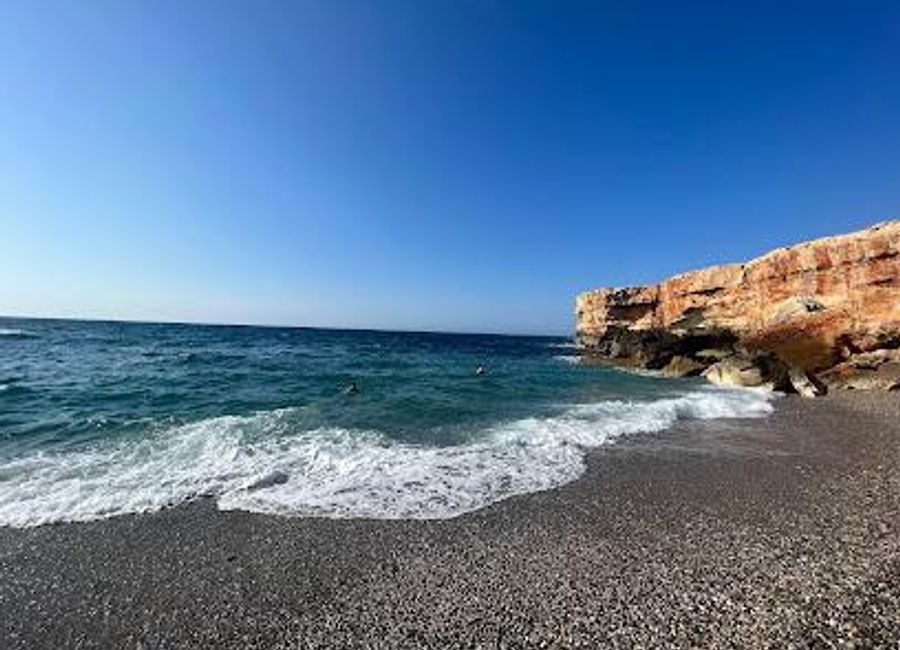 Experience the tranquil beauty of Spilies Beach in Crete, a hidden gem with golden sands and crystal-clear waters, perfect for relaxation and exploration.