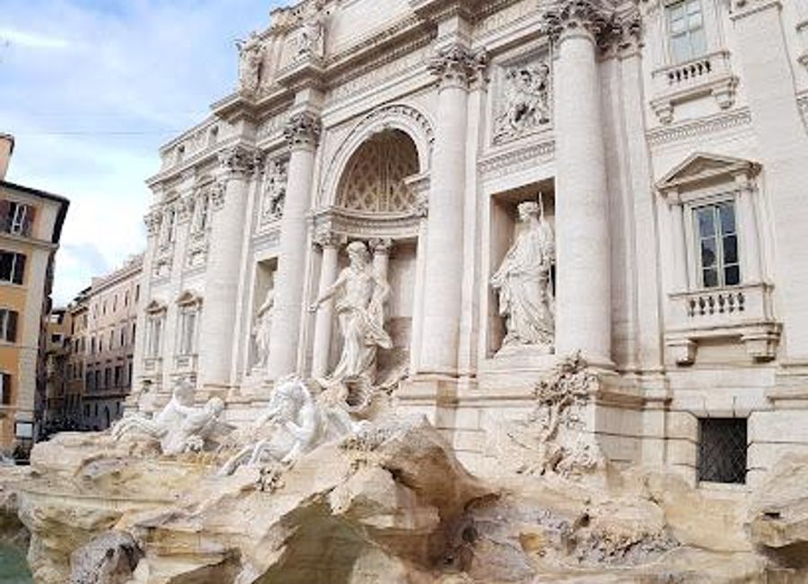 Discover the iconic Trevi Fountain in Rome, where baroque artistry meets timeless tradition, and every coin tossed promises a return to this enchanting city.