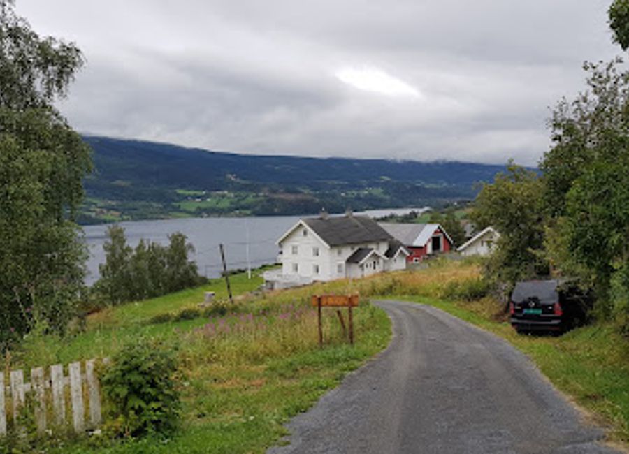 Explore the historic Lomen Stave Church, a stunning example of Norway's stave architecture nestled in the breathtaking landscapes of Lomen.