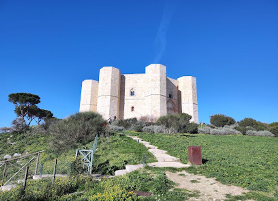 Discover the architectural wonder of Castel del Monte, a 13th-century castle blending cultures and offering stunning Apulian views.