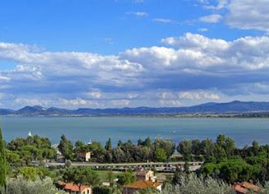 Discover the serene beauty of Lago Trasimeno, a tranquil lake in Umbria, known for its stunning views, outdoor activities, and charming villages.