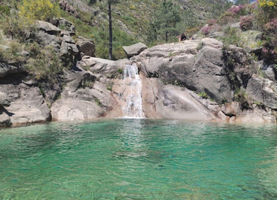 Explore the stunning turquoise waters and breathtaking trails of Poço Azul Gerês, a hiker's paradise in Portugal's national park.