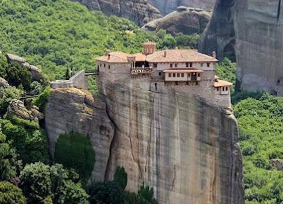 Experience the serenity and beauty of the Holy Monastery of Rousanos, a stunning nunnery in Meteora, rich in history and breathtaking scenery.