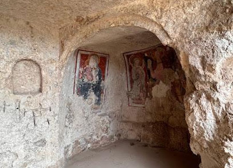Discover the enchanting Chiesa Rupestre di Madonna delle Tre Porte, a rock-hewn chapel rich in history and stunning frescoes in the heart of Matera.