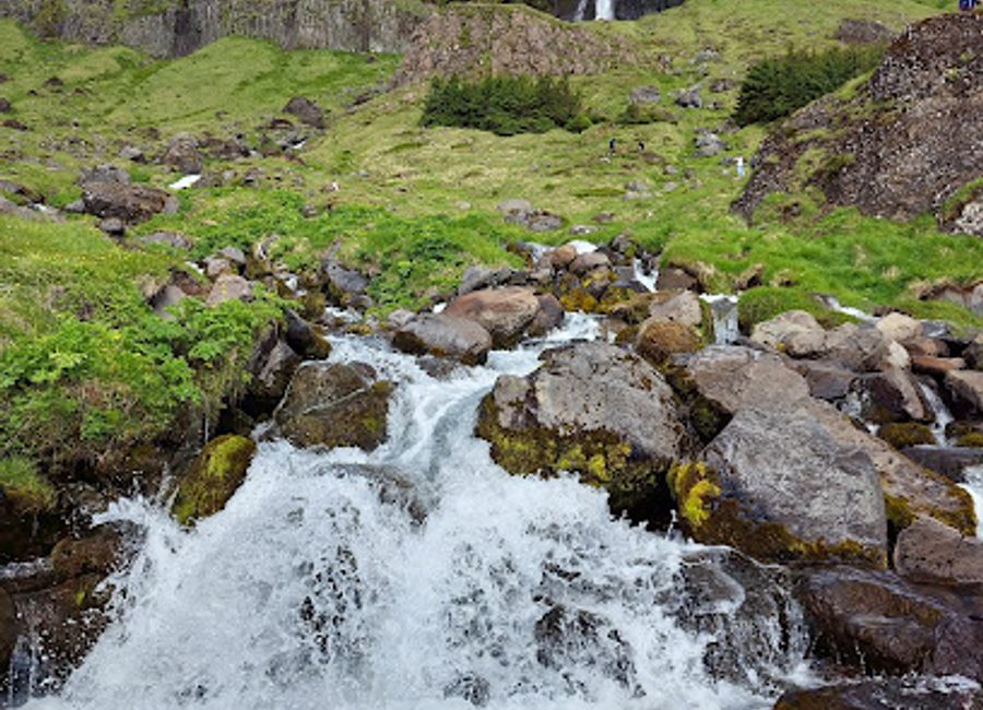 Experience the breathtaking beauty of Bjarnarfoss Waterfall, a hidden gem in Iceland's stunning landscapes, perfect for nature lovers and photographers.