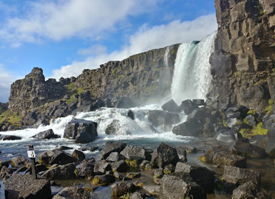 Discover the enchanting Öxarárfoss waterfall in Thingvellir National Park, a stunning fusion of nature and history in Iceland's breathtaking landscape.