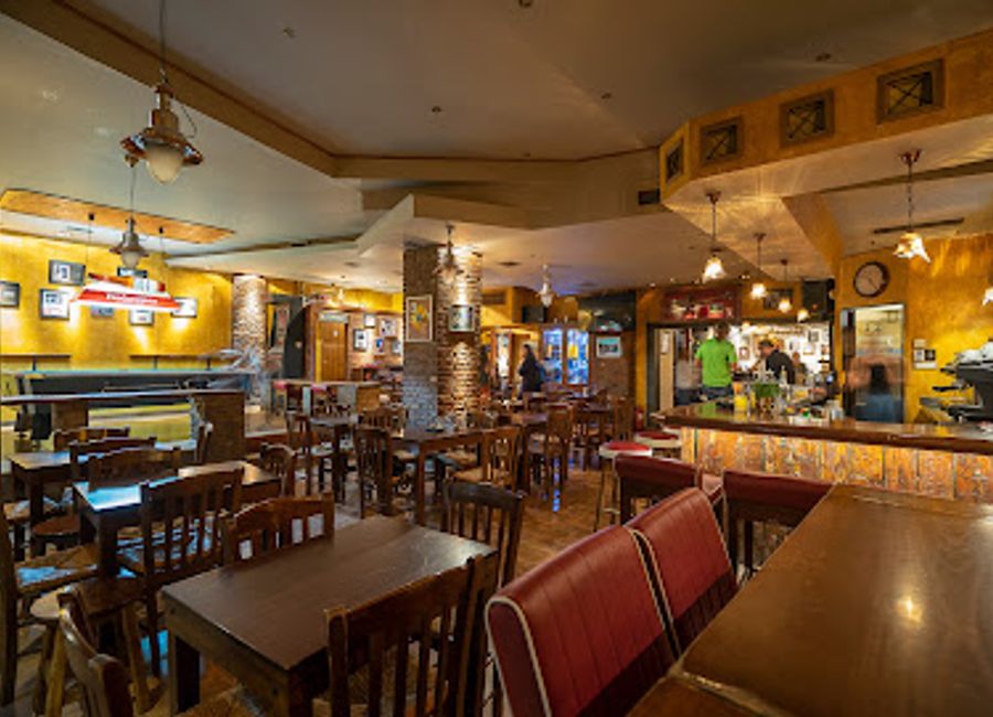 Experience the vibrant atmosphere of Rapsodia, a must-visit bar and café in Kalampaka, perfect for enjoying local drinks and cuisine.