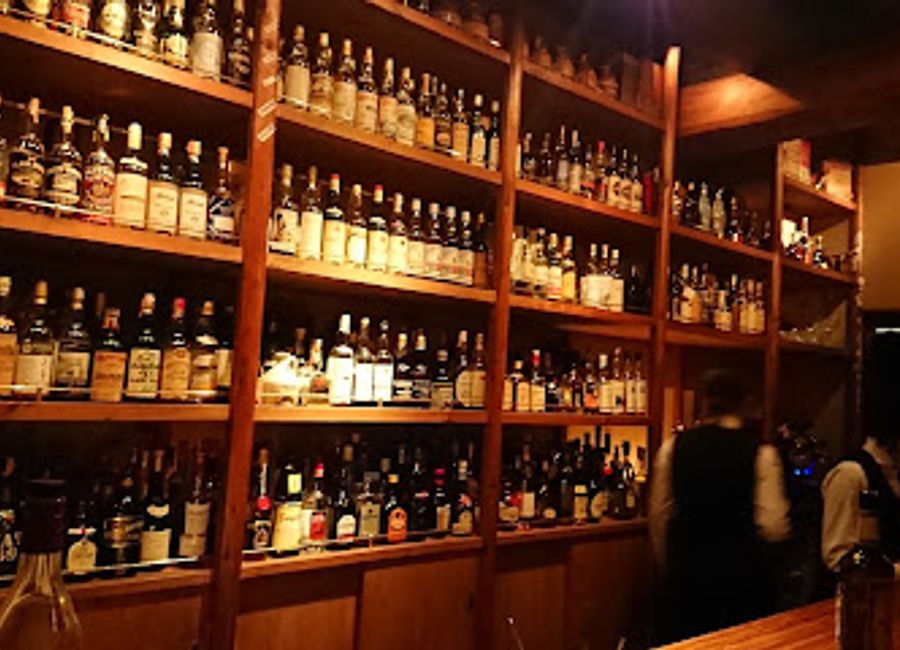 Experience the vibrant nightlife of Kyoto at bar K-ya, a cozy bar offering a remarkable selection of drinks in a charming ambiance.