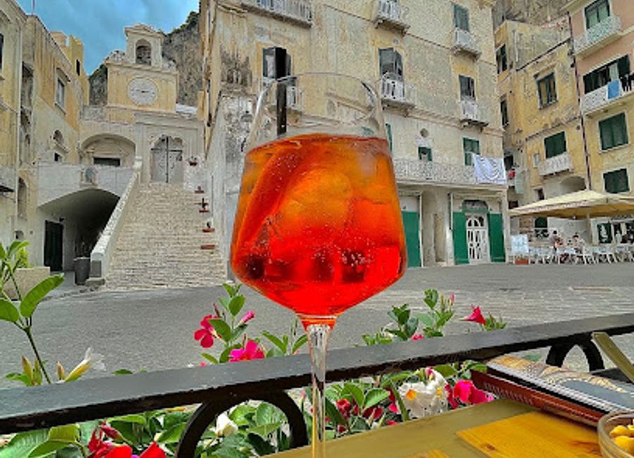 Experience the best of Italian wine and cocktails at Wine Bar La Risacca, nestled in the picturesque Atrani, perfect for relaxation after exploring the Amalfi Coast.