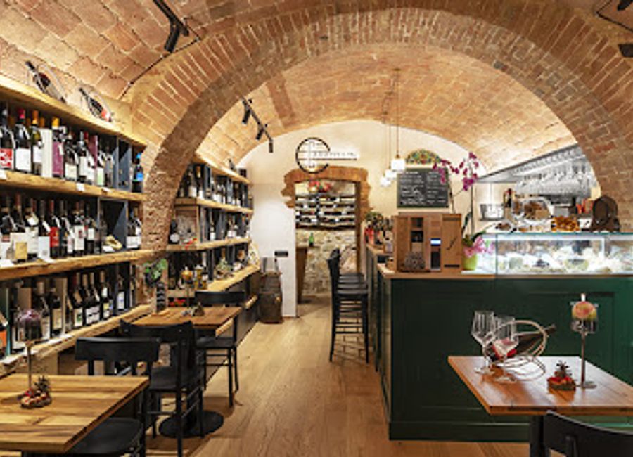 Discover exquisite local wines and immerse yourself in the charming ambiance of Enoteca Caratello's in Montepulciano, Tuscany.