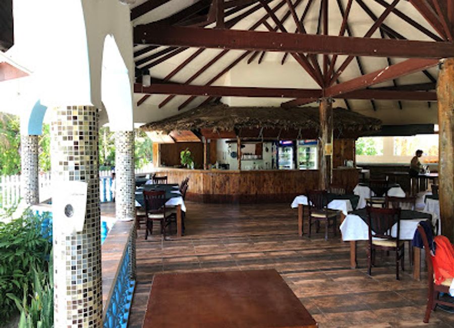 Experience the serene beauty of Grand Anse Beach Bar in La Digue, where tropical vibes meet exquisite dining and breathtaking ocean views.