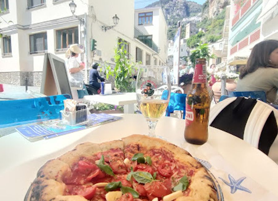 Experience the essence of Italian hospitality at La Dolce Vita, a charming bar and café in the heart of Amalfi, perfect for a refreshing break.