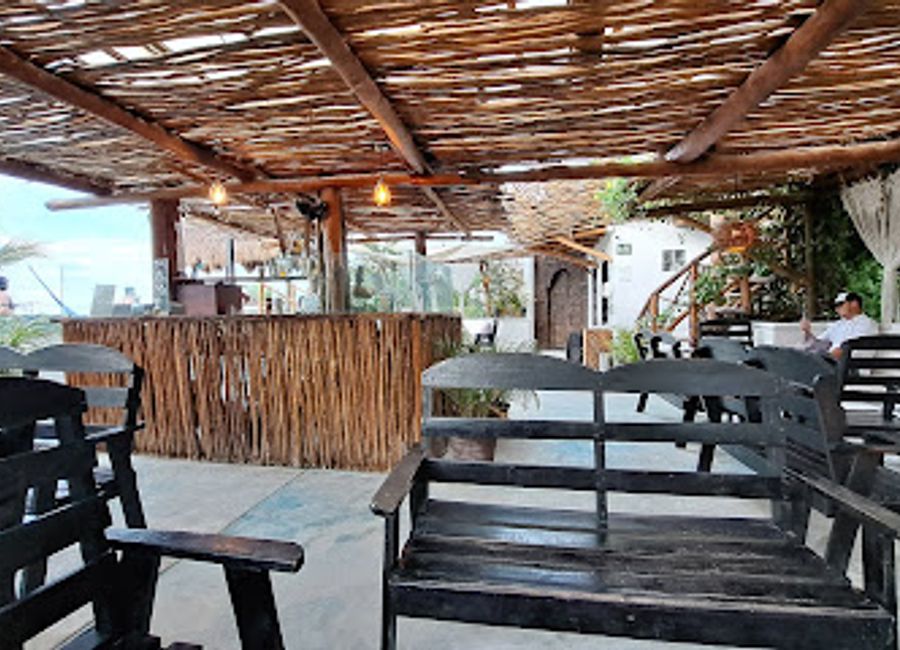 Experience the vibrant atmosphere and refreshing flavors at ALMA Bar in Holbox, a perfect blend of relaxation and culinary delight.