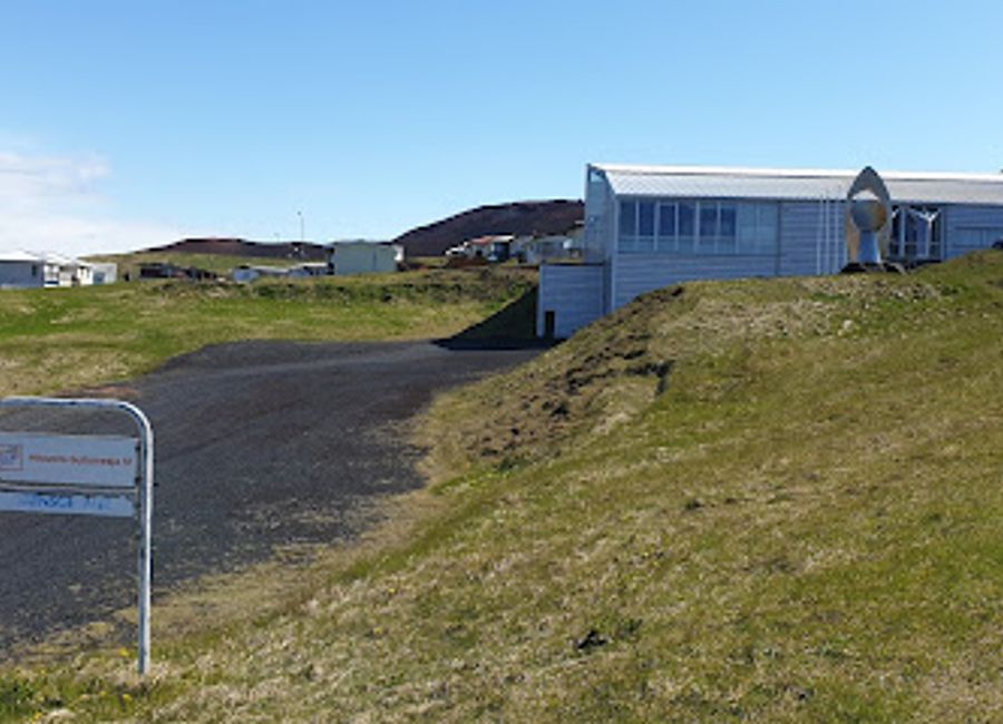 Experience the lively spirit of Vestmannaeyjabær at Höllin, a local bar offering a fantastic selection of drinks and a cozy atmosphere.