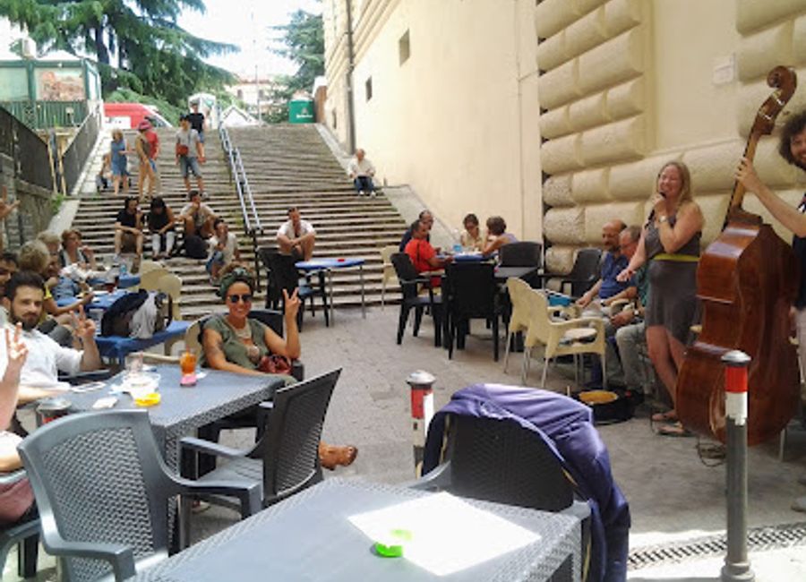 Experience the heart of Perugia at Caffè Bonazzi, where delightful wines and a warm atmosphere await every traveler.