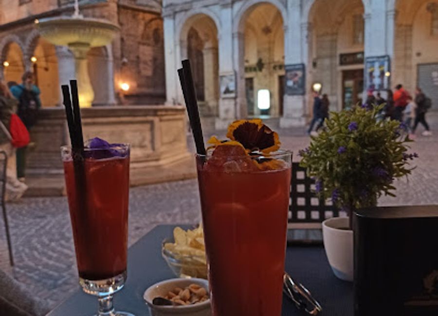 Discover the heart of Urbino at Rio's Bar, where lively ambiance meets Italian hospitality in a historic setting.