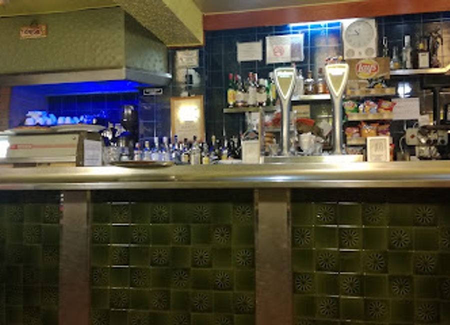 Experience the authentic flavors and vibrant atmosphere of Bar Aragonés in the heart of Boltaña, a perfect retreat for every traveler.