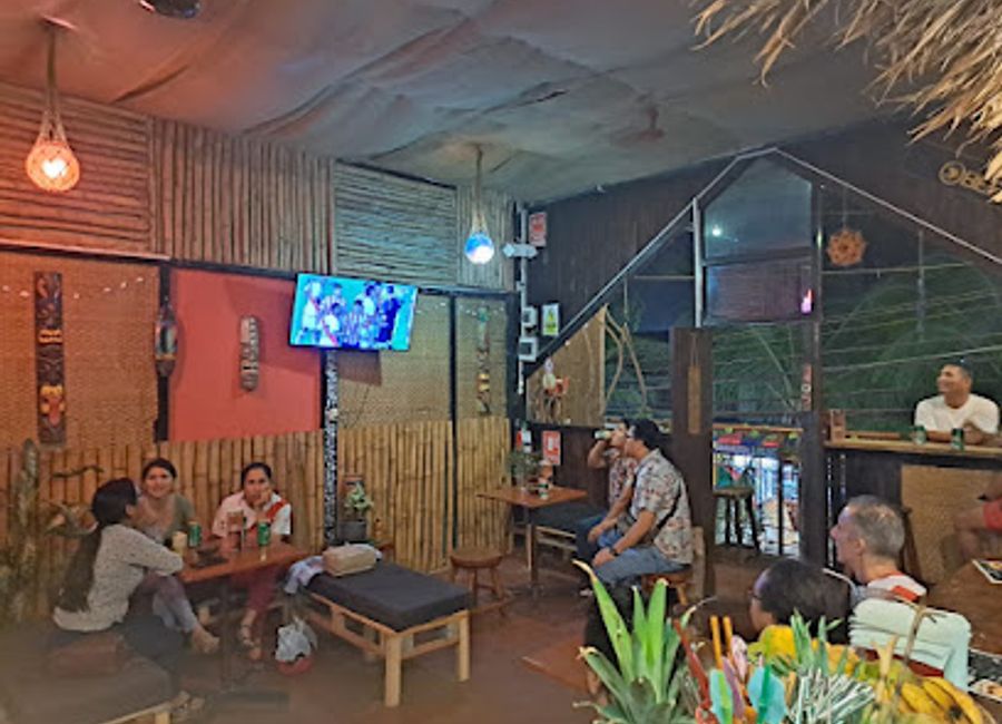 Experience the ultimate tropical escape at Bamboo Bar Tiki Hut in Puerto Maldonado, featuring exotic cocktails and a vibrant atmosphere.