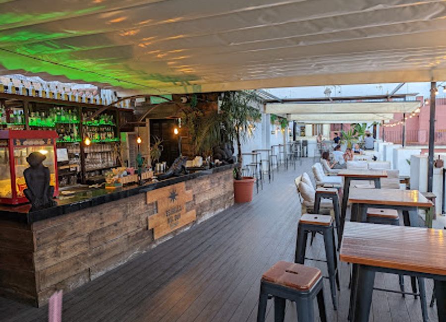 Experience the vibrant nightlife of Seville at Pura Vida Terraza, a rooftop bar offering stunning views and exquisite cocktails.