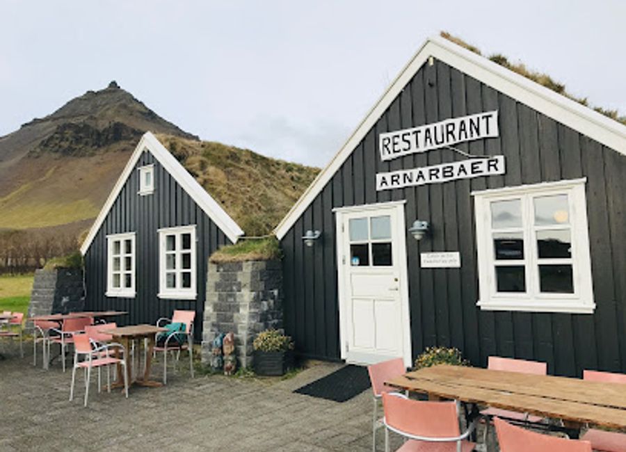 Discover the flavors of Iceland at Arnarbær, a cozy restaurant in Arnarstapi offering local dishes and a warm atmosphere.