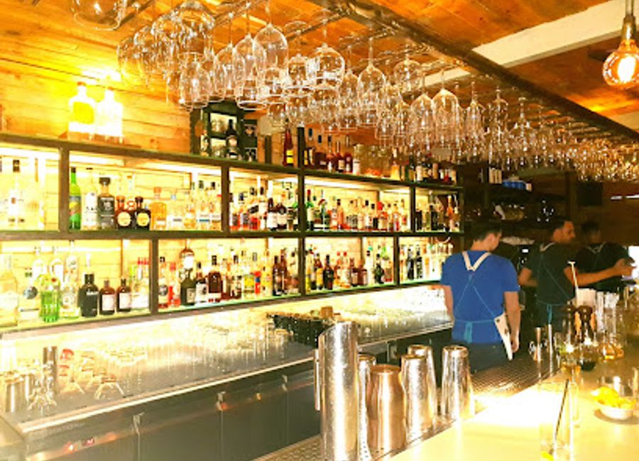 Discover the charm of Couleur Locale, a vibrant bar and bistro in Athens offering Mediterranean delights and stunning views of the Acropolis.