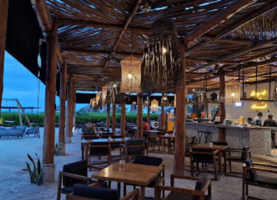 Discover the laid-back charm of Kuká Bar in Holbox, where refreshing cocktails and stunning sunsets create the perfect tropical escape.