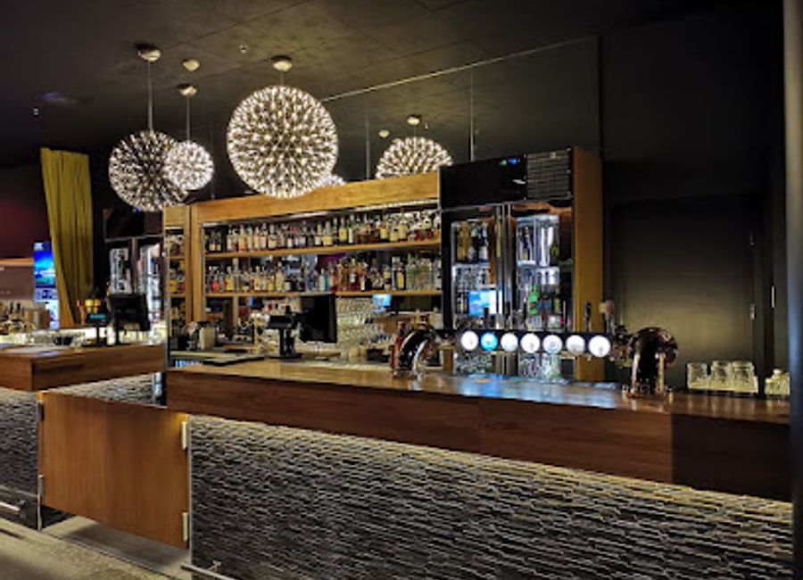 Experience the cozy charm and breathtaking views of Molldøra Lounge & Bar in Svolvær, the perfect place to relax and enjoy local beverages.