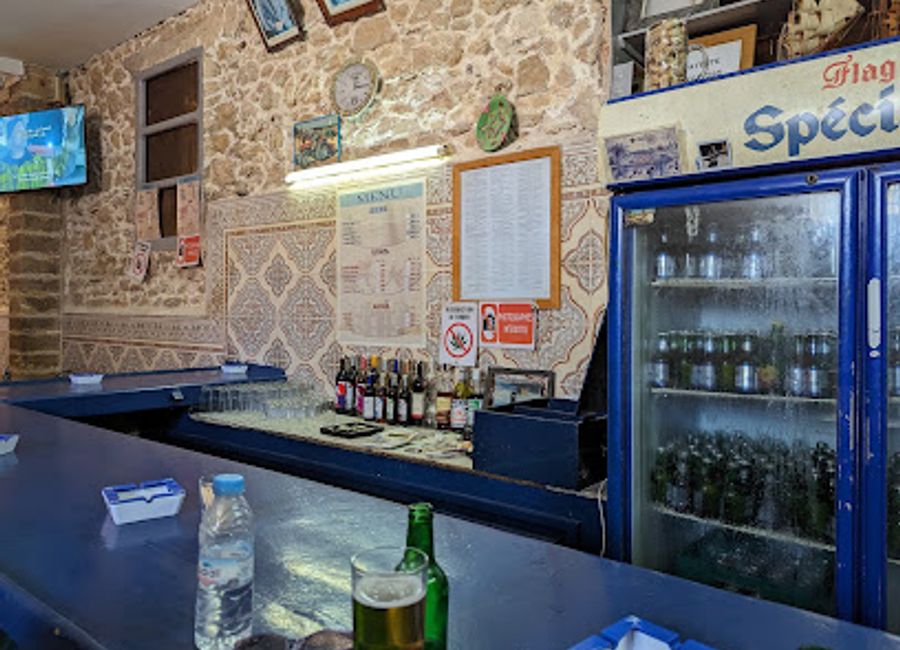 Experience the vibrant atmosphere of Unknown But Cheap, a charming bar in Essaouira's Medina offering affordable drinks and a taste of local culture.