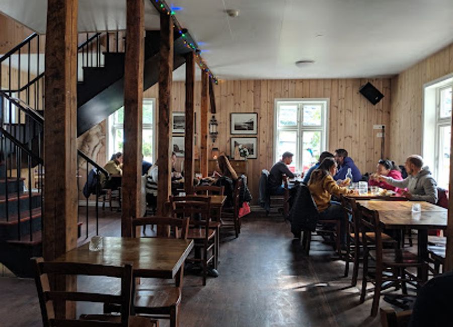 Experience delightful cuisine and local brews at Kaffi Lára El Grillo Bar, a cozy restaurant in Seyðisfjörður's picturesque surroundings.