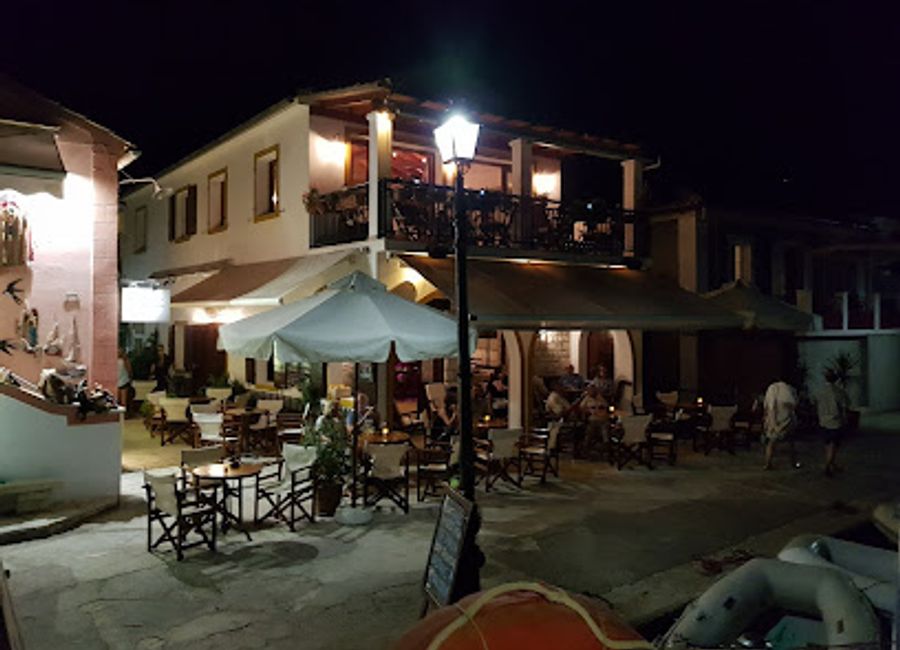 Experience the vibrant atmosphere and expertly crafted cocktails at Romantica Café-bar in Lakka, the perfect spot for relaxation and socializing.