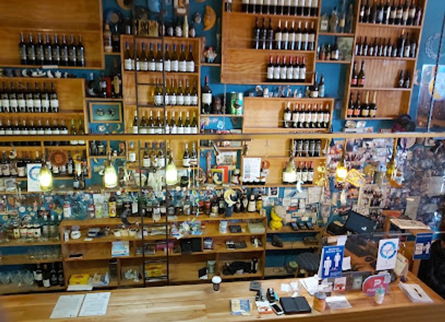 Experience the vibrant atmosphere and local flavors at El Puesto Restobar in Puerto Natales, the perfect spot to unwind after your Patagonian adventures.