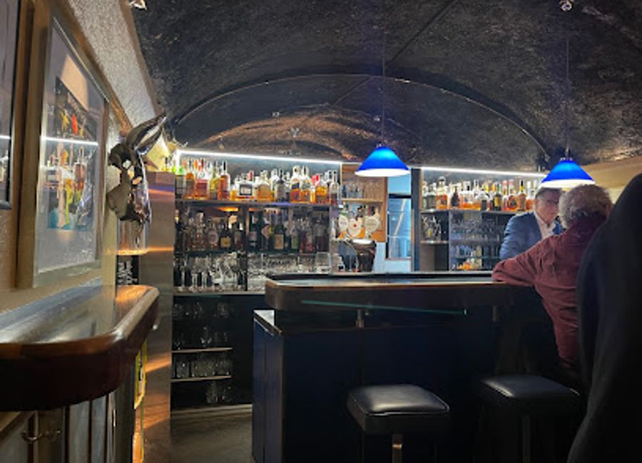 Experience the vibrant atmosphere of Fridrich Bar in Salzburg, where exquisite cocktails and a cozy ambiance await every visitor.