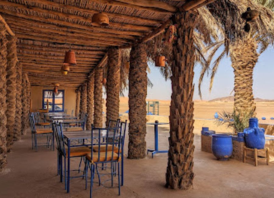 Experience the rich flavors of authentic Moroccan cuisine at Restaurant Nora in the heart of the Sahara Desert, Merzouga.
