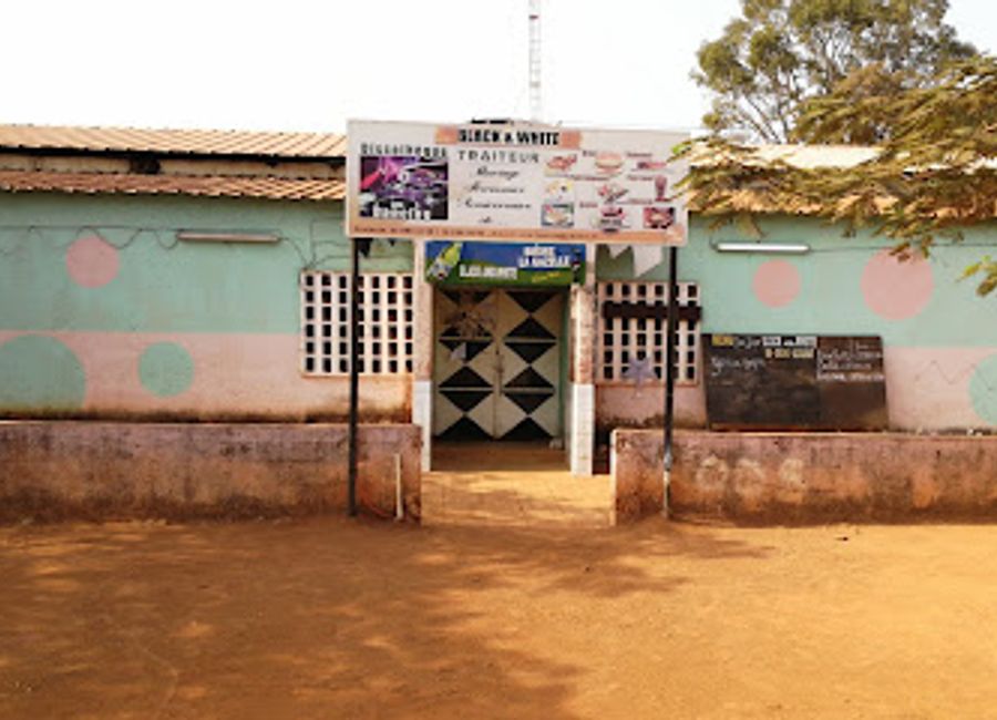 Discover the vibrant atmosphere of Black And White in Kedougou, where local flavors and lively ambiance create the perfect dining experience.