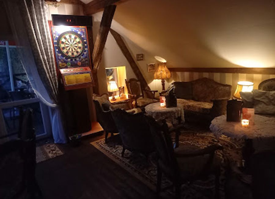 Discover the charm of Antyk Cafe in Szczytno, where darts and delightful drinks come together in a cozy, inviting atmosphere.