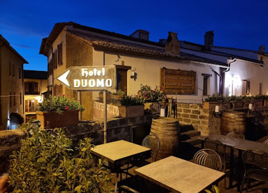 Discover the enchanting Enoteca al Duomo in Orvieto, where exquisite wines and delightful dishes meet in a picturesque setting.