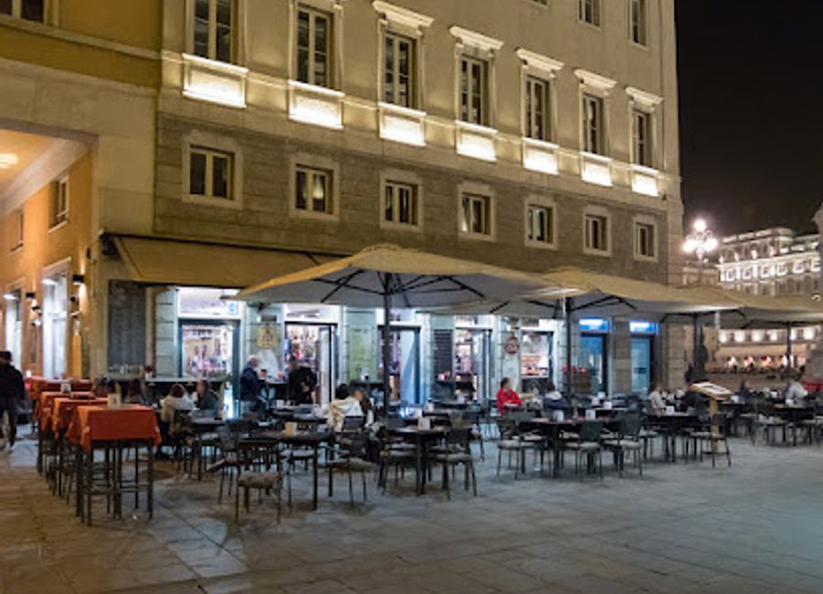 Experience the vibrant atmosphere and authentic flavors of Italy at Gran Bar Unità, Trieste's premier social hub.