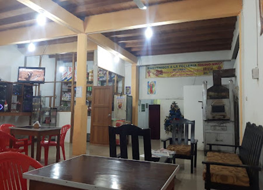 Experience the authentic taste of Peru at Polleria Divino Niño, where succulent rotisserie chicken and local flavors come together in a vibrant setting.