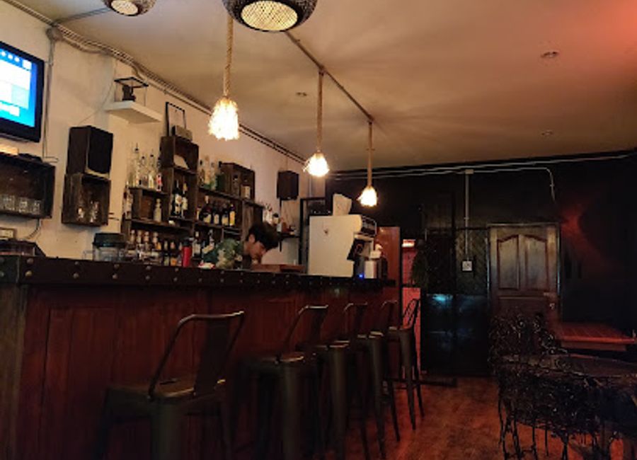 Experience the vibrant atmosphere and exquisite cocktails at Vibe Kanchanaburi, the perfect riverside retreat for tourists seeking relaxation and enjoyment.